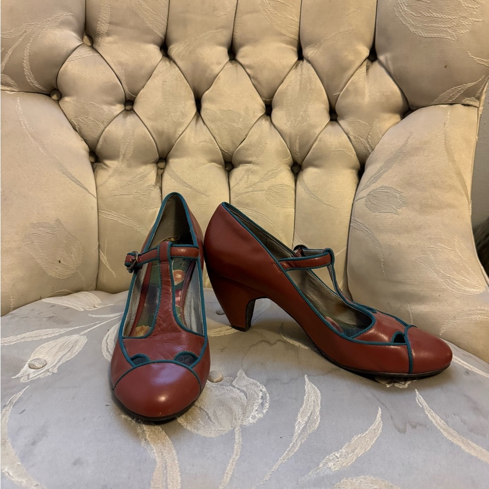 Anthropologie Pink Studio retro brown heels with green trim.